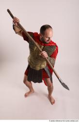 Man Adult Average White Fighting with spear Standing poses Casual